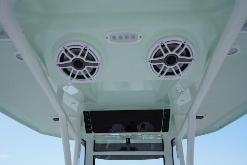 Slide: The Image of 2026 Tidewater 282 CC Adventure boat speakers and console detail. - 85