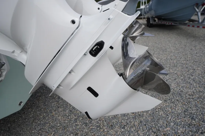 Slide: The Image of Close-up of 2026 Tidewater 282 CC Adventure boat propeller on gravel surface. - 88