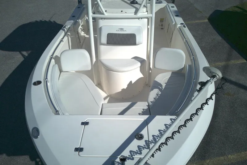 Slide: The Image of 2022 Cobia 201 Center Console boat interior with seating and storage compartments. - 12