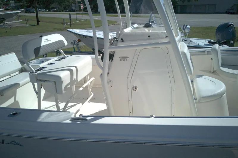 Slide: The Image of 2022 Cobia 201 Center Console boat interior with seating and helm station. - 3