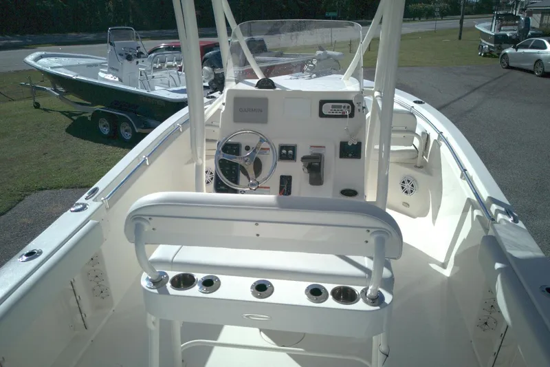 Slide: The Image of 2022 Cobia 201 Center Console boat interior with steering wheel and controls. - 4