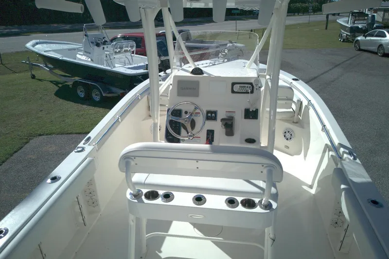 Slide: The Image of 2022 Cobia 201 Center Console boat interior with steering wheel and controls. - 6