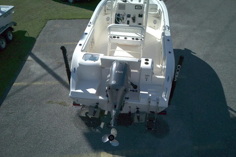 Slide: The Image of 2022 Cobia 201 Center Console boat with outboard motor, viewed from above. - 8
