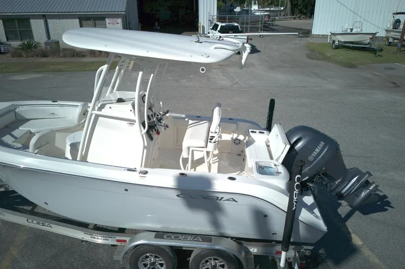 Slide: The Image of 2022 Cobia 201 Center Console boat with Yamaha engine on trailer. - 9