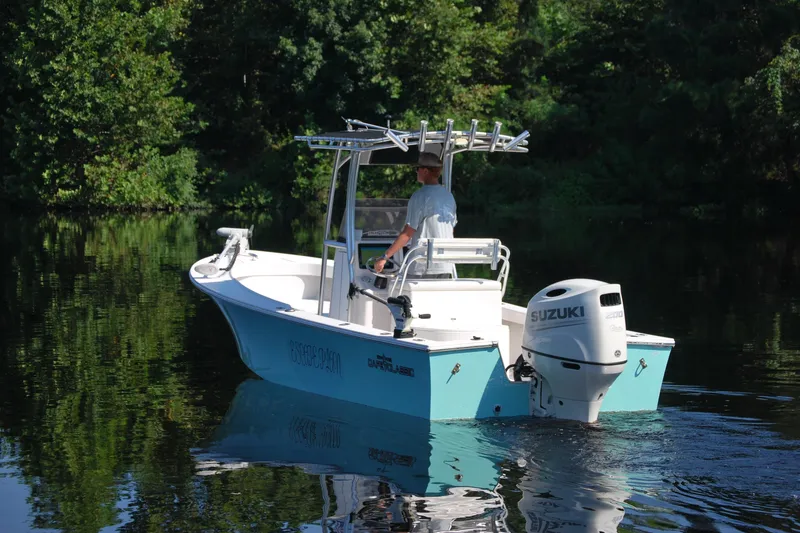 Slide: The Image of 2021 May-Craft 23 Cape Classic boat with Suzuki engine on calm water. - 1