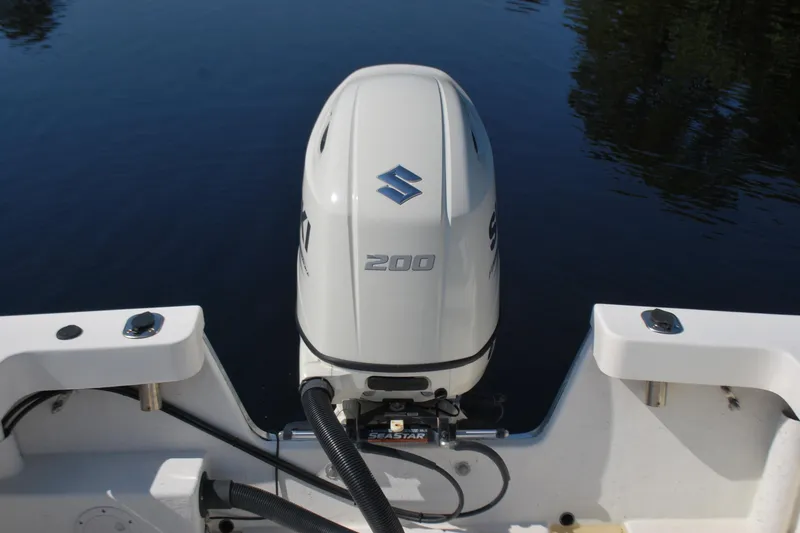 Slide: The Image of 2021 May-Craft 23 Cape Classic boat with Suzuki 200 outboard motor on calm water. - 12