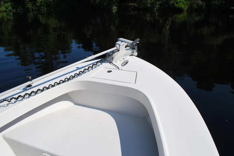 Slide: The Image of 2021 May-Craft 23 Cape Classic boat bow on calm water. - 3