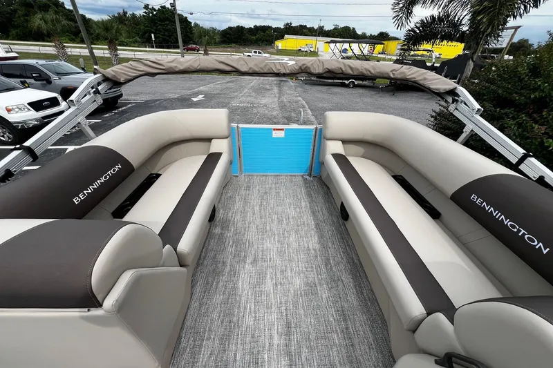 Slide: The Image of 2026 Bennington S22 pontoon boat interior with plush seating and modern design. - 13