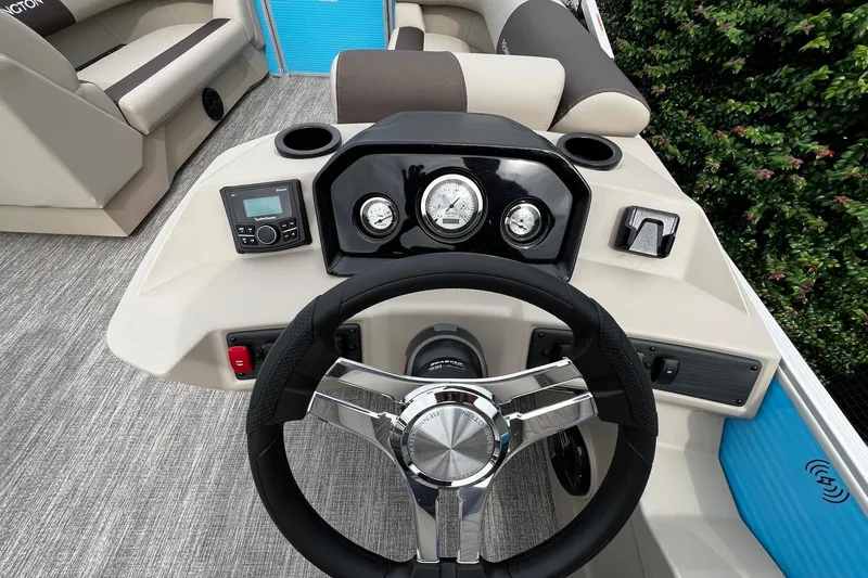 Slide: The Image of 2026 Bennington S22 boat dashboard with steering wheel, gauges, and control panel. - 15