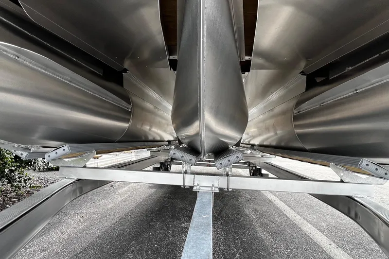 Slide: The Image of Underneath view of a 2026 Bennington S22 pontoon boat on a trailer. - 16