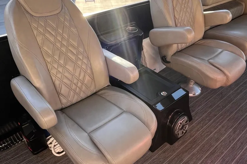 Slide: The Image of Luxurious seating in 2023 Premier 310 Boundary Waters Revolution Top Deck boat interior. - 10