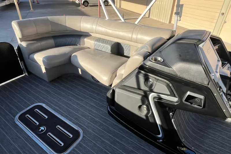 Slide: The Image of 2023 Premier 310 Boundary Waters Revolution Top Deck with luxurious seating and modern dashboard. - 11