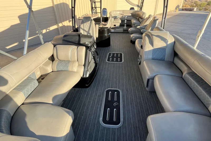 Slide: The Image of Luxurious interior of 2023 Premier 310 Boundary Waters Revolution Top Deck pontoon boat. - 13