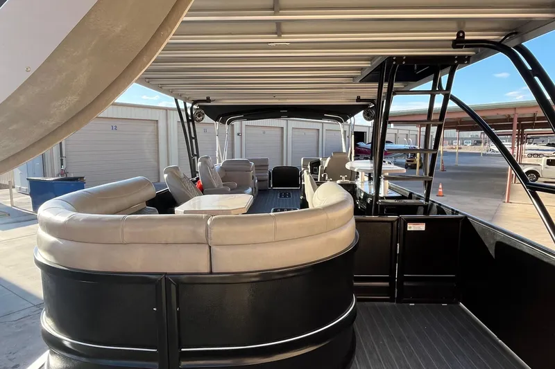 Slide: The Image of 2023 Premier 310 Boundary Waters Revolution Top Deck pontoon boat with luxurious seating. - 14