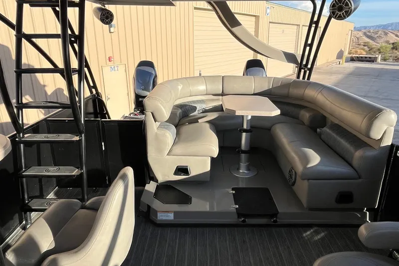 Slide: The Image of 2023 Premier 310 Boundary Waters Revolution Top Deck with luxurious seating and modern design. - 5