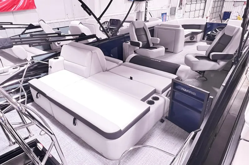 Slide: The Image of 2025 Harris Cruiser 230 Heritage Edition interior with luxurious seating and modern design. - 12