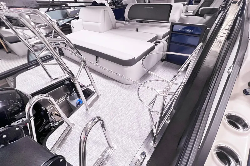 Slide: The Image of 2025 Harris Cruiser 230 Heritage Edition interior with sleek seating and polished metal accents. - 14