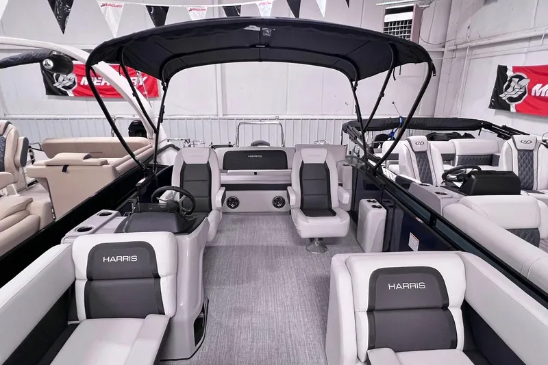 Slide: The Image of 2025 Harris Cruiser 230 Heritage Edition pontoon boat interior with luxurious seating and canopy. - 3