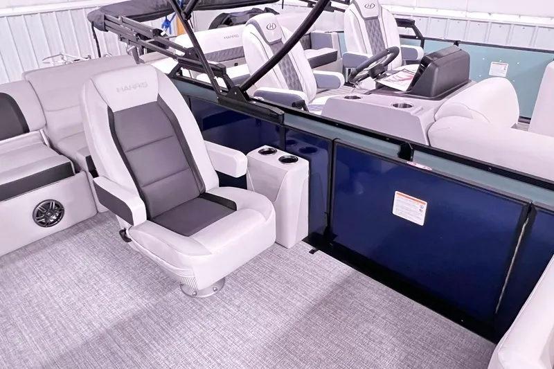 Slide: The Image of 2025 Harris Cruiser 230 Heritage Edition interior with plush seating and modern design. - 8