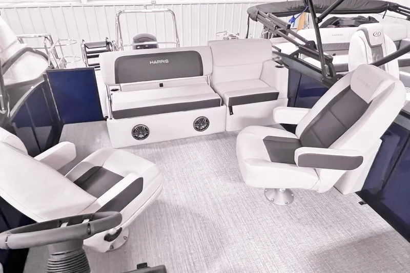 Slide: The Image of Interior of 2025 Harris Cruiser 230 Heritage Edition with luxurious seating and modern design. - 11