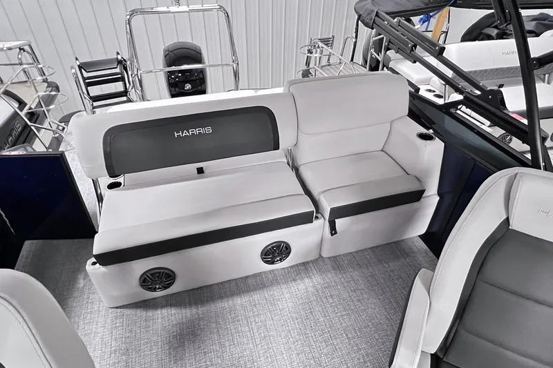 Slide: The Image of 2025 Harris Cruiser 230 Heritage Edition interior with plush seating and modern design. - 12