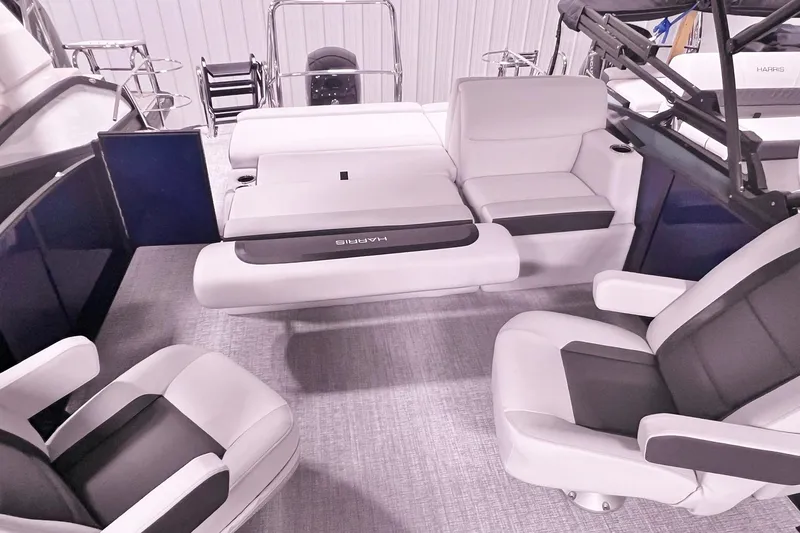 Slide: The Image of 2025 Harris Cruiser 230 Heritage Edition interior with luxurious seating and modern design. - 13