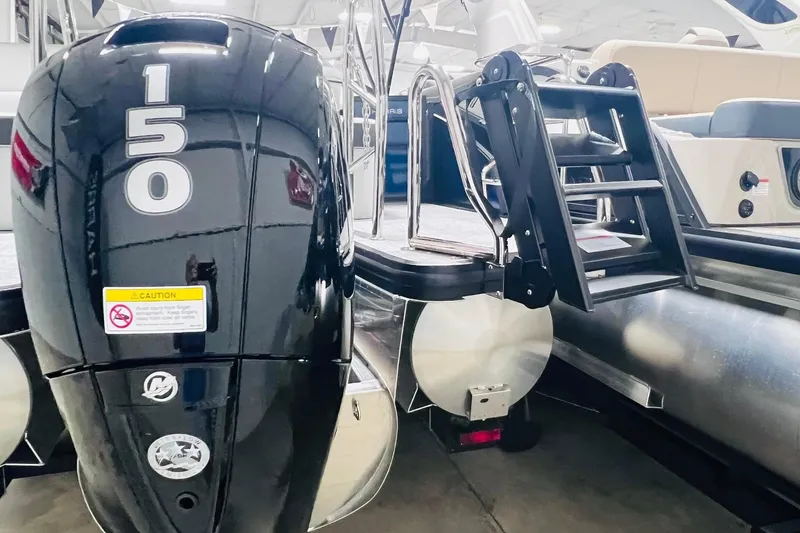 Slide: The Image of 2025 Harris Cruiser 230 Heritage Edition with powerful 150 HP outboard motor. - 19