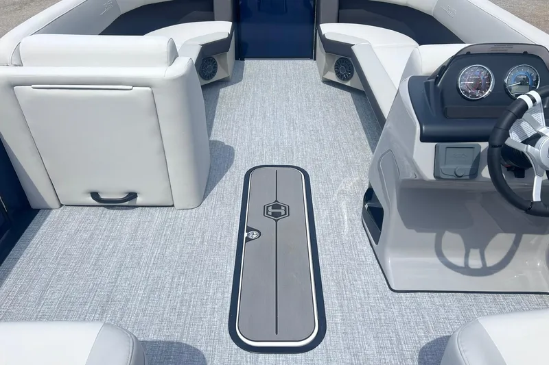 Slide: The Image of Interior of 2026 Harris Cruiser 230 boat with modern seating and steering console. - 7