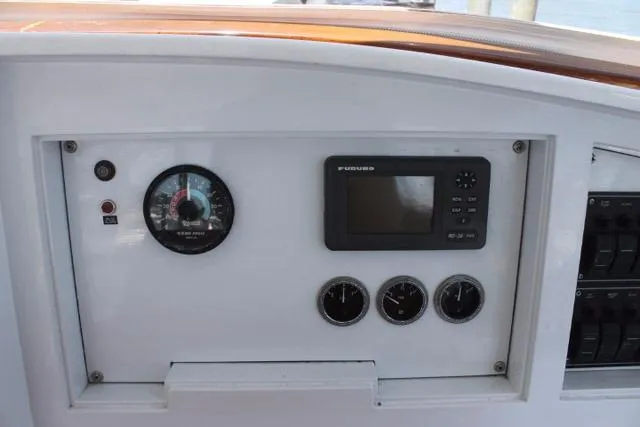 Slide: The Image of Control panel of 2005 Custom DeSanti Carolina Express boat with gauges and display. - 29
