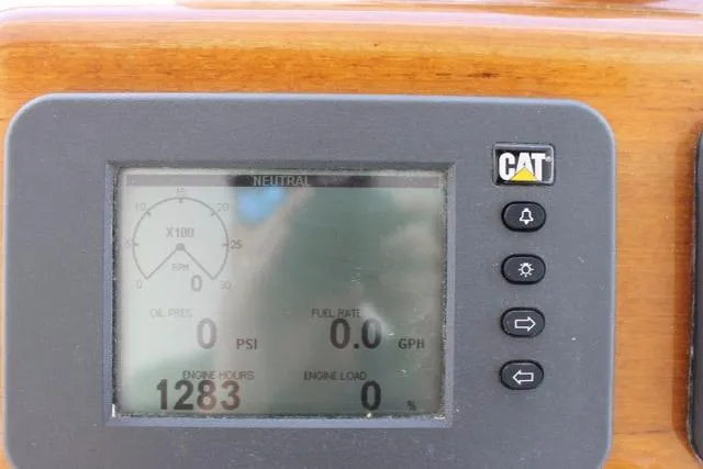 Slide: The Image of Digital display on 2005 DeSanti Carolina Express showing engine metrics and CAT logo. - 30