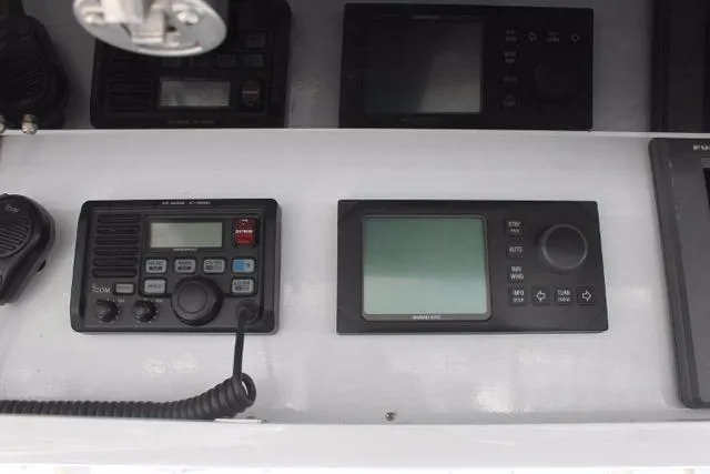 Slide: The Image of Control panel of a 2005 Custom DeSanti Carolina Express boat with navigation equipment. - 33