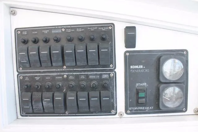 Slide: The Image of Control panel of 2005 Custom DeSanti Carolina Express with Kohler generator switches. - 35