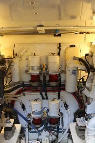 Slide: The Image of Engine room of 2005 Custom DeSanti Carolina Express with visible filters and wiring. - 40