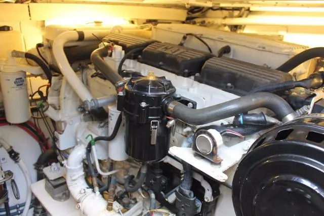 Slide: The Image of Engine room of 2005 Custom DeSanti Carolina Express boat, showcasing detailed mechanical components. - 41