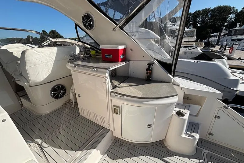 Slide: The Image of 2005 Regal Commodore 4260 yacht interior with seating, counter, and storage. - 15
