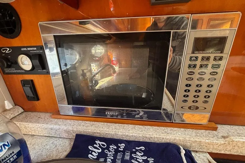 Slide: The Image of Microwave oven inside 2005 Regal Commodore 4260 yacht kitchen area. - 18