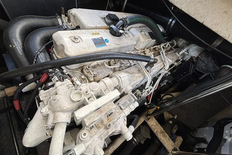 Slide: The Image of Engine of a 2005 Regal Commodore 4260 boat, showcasing intricate mechanical components. - 29