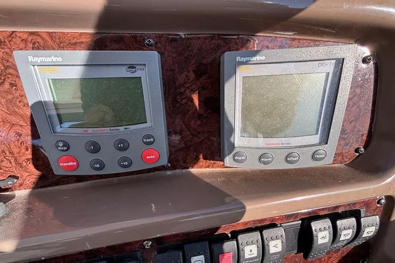 Slide: The Image of Control panel of a 2005 Regal Commodore 4260 with Raymarine displays. - 8