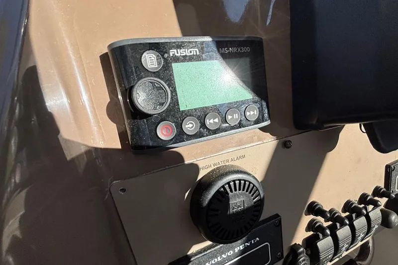 Slide: The Image of Control panel of a 2005 Regal Commodore 4260 boat with Fusion MS-NRX300. - 9