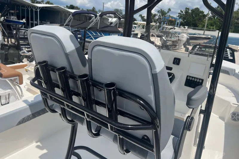 Slide: The Image of 2026 Defiance Catalina 240 boat interior with dual seats and rod holders. - 12