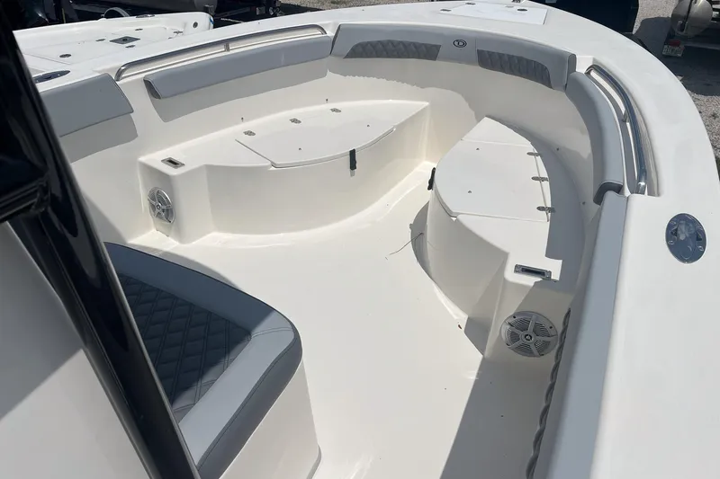 Slide: The Image of Interior view of 2026 Defiance Catalina 240 boat, featuring spacious seating and modern design. - 14