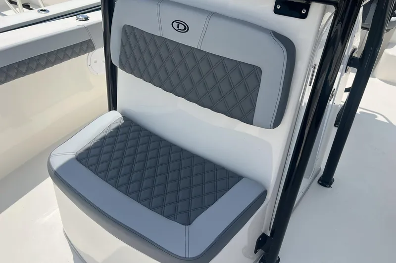 Slide: The Image of Gray cushioned seat on 2026 Defiance Catalina 240 boat, featuring diamond stitching design. - 17