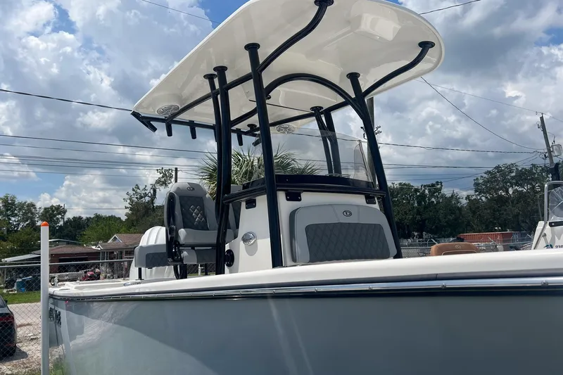 Slide: The Image of 2026 Defiance Catalina 240 boat with T-top under cloudy sky. - 2