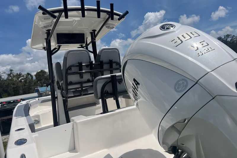 Slide: The Image of 2026 Defiance Catalina 240 boat with Yamaha 300 V6 engine under a clear sky. - 5