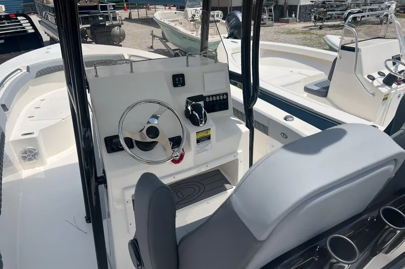 Slide: The Image of 2026 Defiance Catalina 240 boat interior with steering wheel and control panel. - 6
