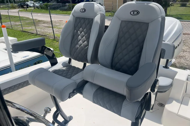 Slide: The Image of Luxury seating on 2026 Defiance Catalina 240 boat, featuring diamond-stitched upholstery. - 8