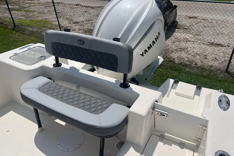 Slide: The Image of 2026 Defiance Catalina 240 boat with Yamaha engine, featuring cushioned seating and sleek design. - 9