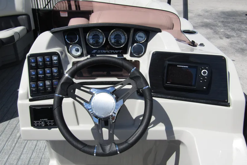 Slide: The Image of 2021 Starcraft SLS 1 boat dashboard with steering wheel and control panel. - 16