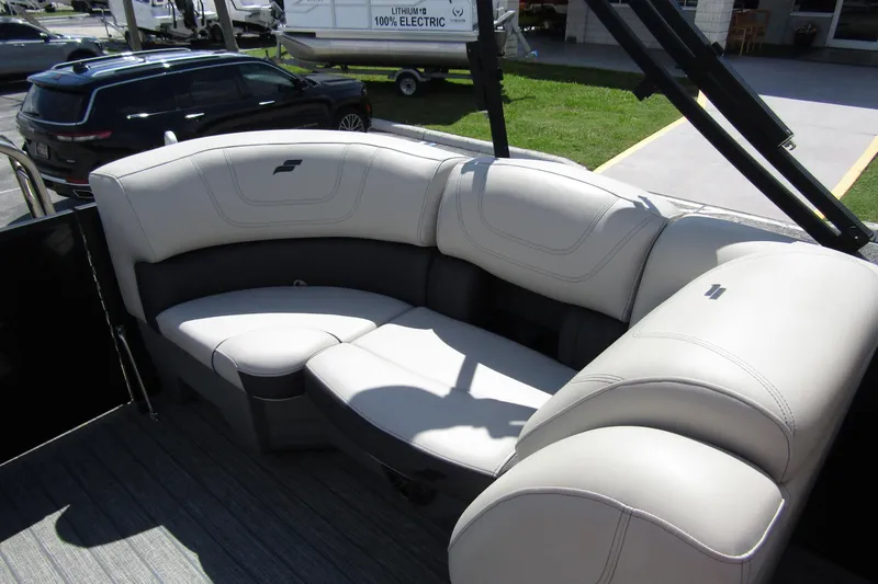 Slide: The Image of Luxurious seating on 2021 Starcraft SLS 1 boat, featuring plush, curved upholstery. - 21