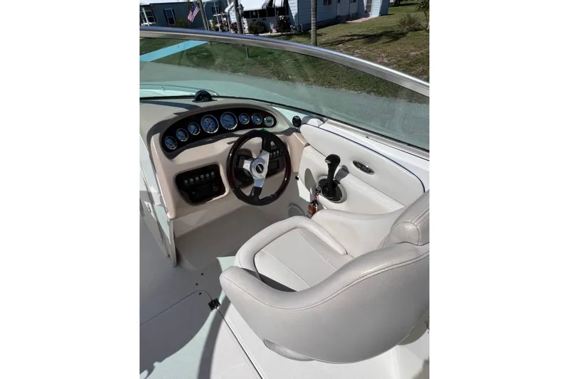 Slide: The Image of 2003 Chaparral 230 SSi boat cockpit with steering wheel and control panel. - 13